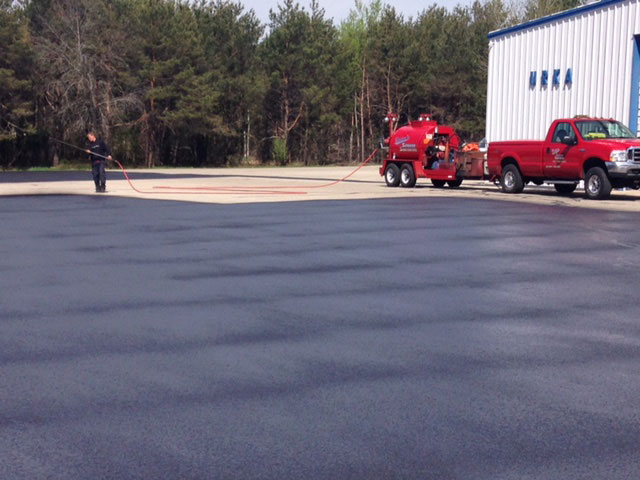 sealcoating asphalt parking lots commercial sealcoating manistee michigan