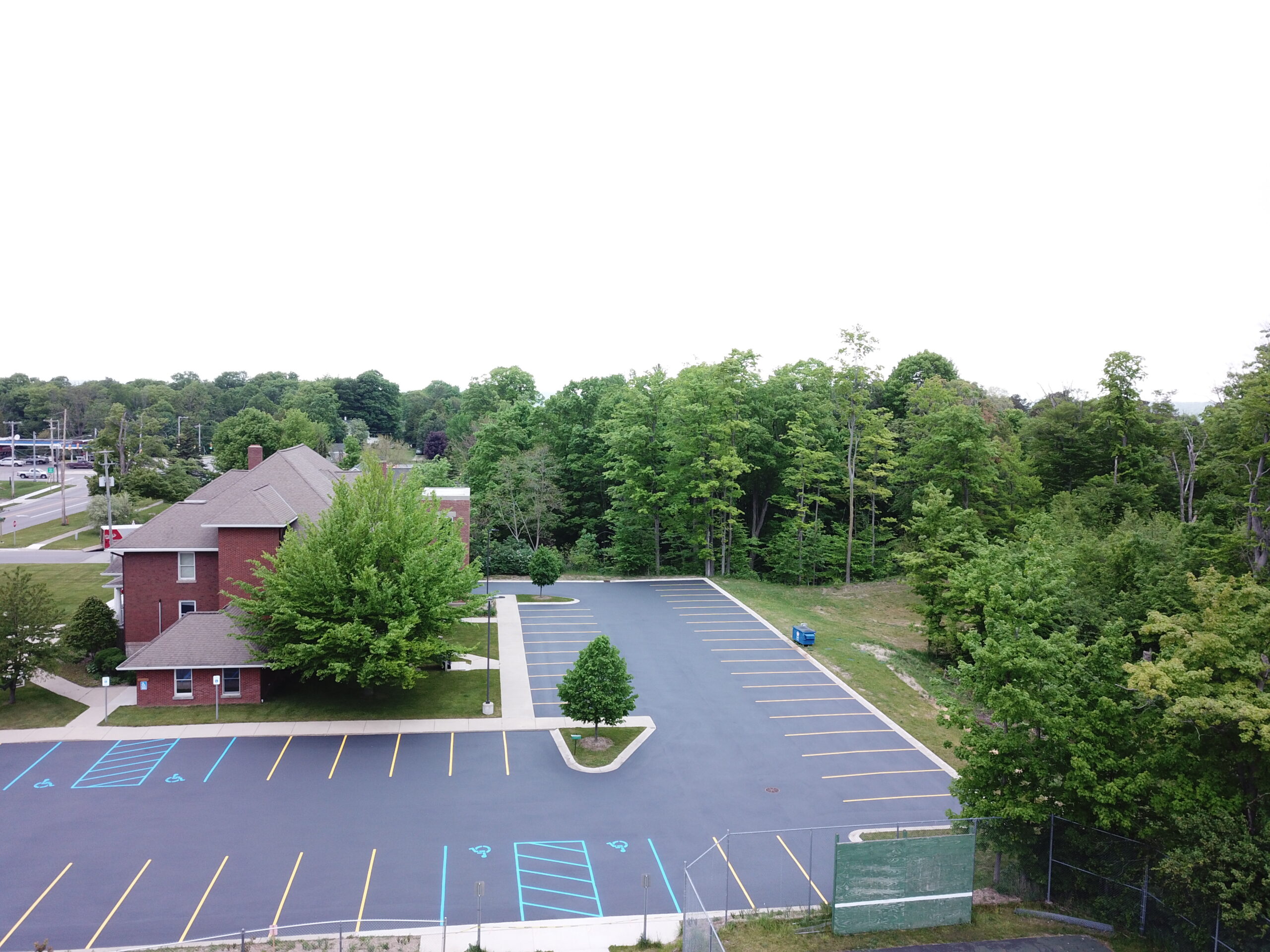 parking lot blacktop seal coating and striping services by brian's superior sealcoating in Manistee County michigan 